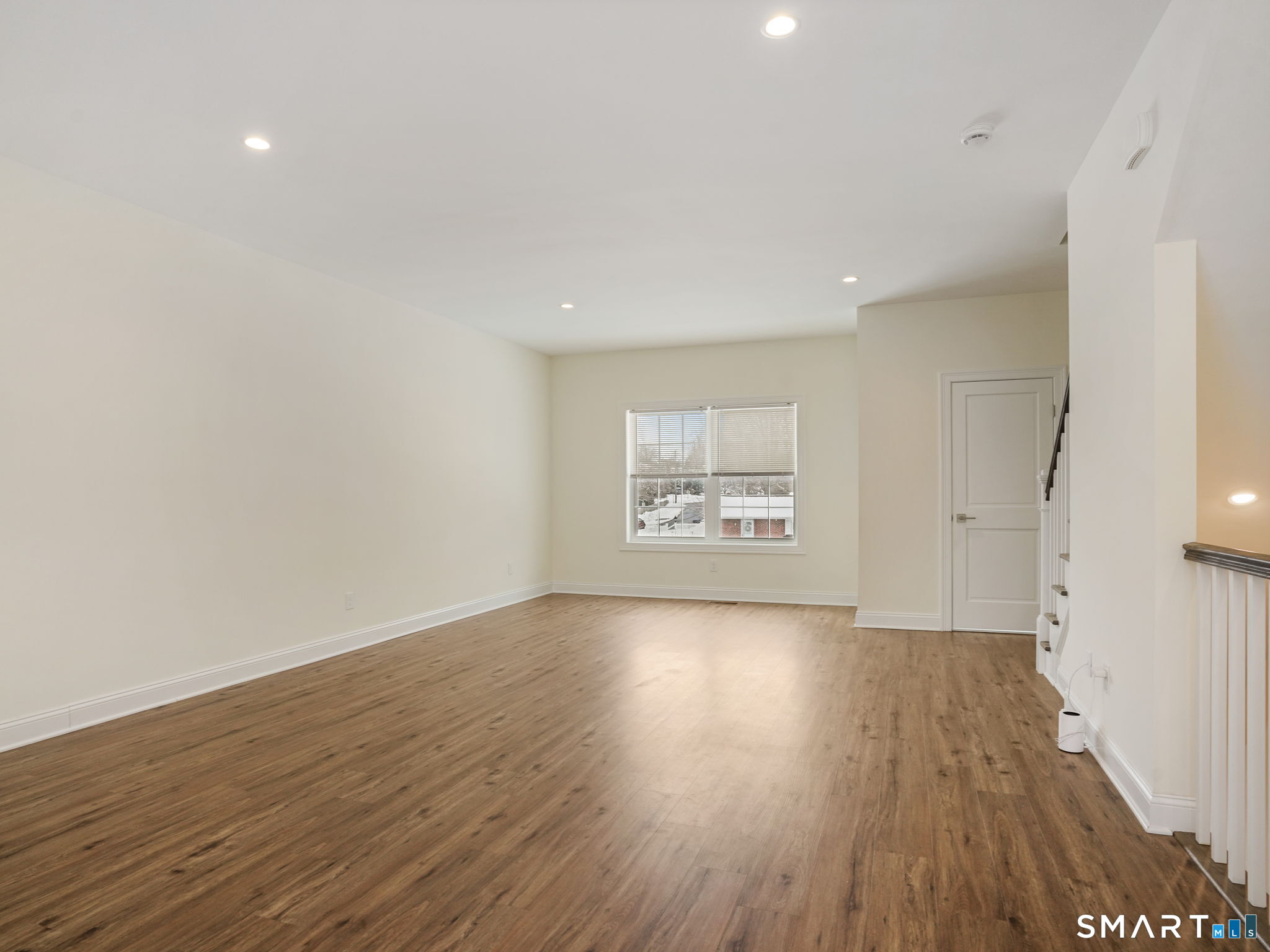 6 Beacon Square, Unit 7 Fairfield, CT 06825 - Photo 4 of 33 a view of an empty room with wooden floor