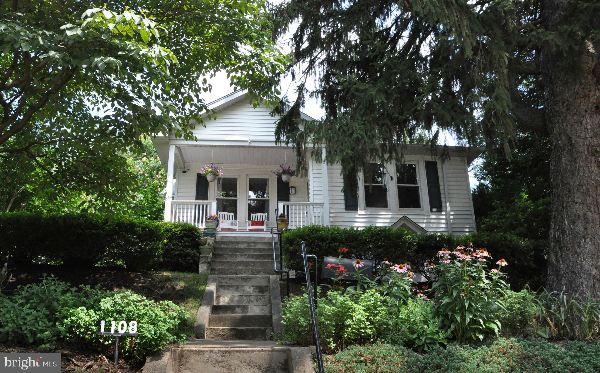 1108 Overbrook Road Baltimore, MD 21239 - Photo 1 of 20 front view of a house with a garden