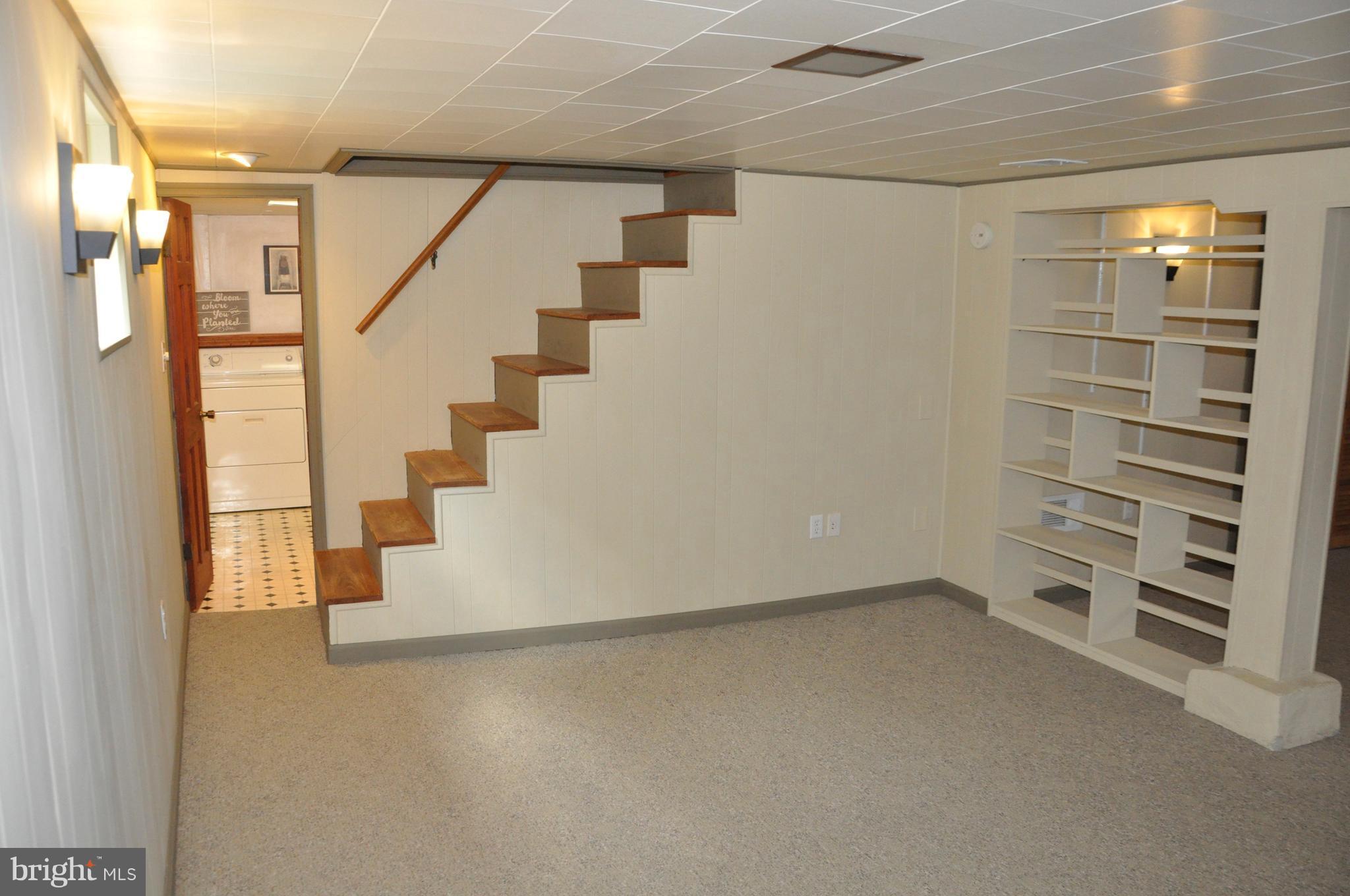 1108 Overbrook Road Baltimore, MD 21239 - Photo 13 of 20 a view of an empty room with stairs and ventilation