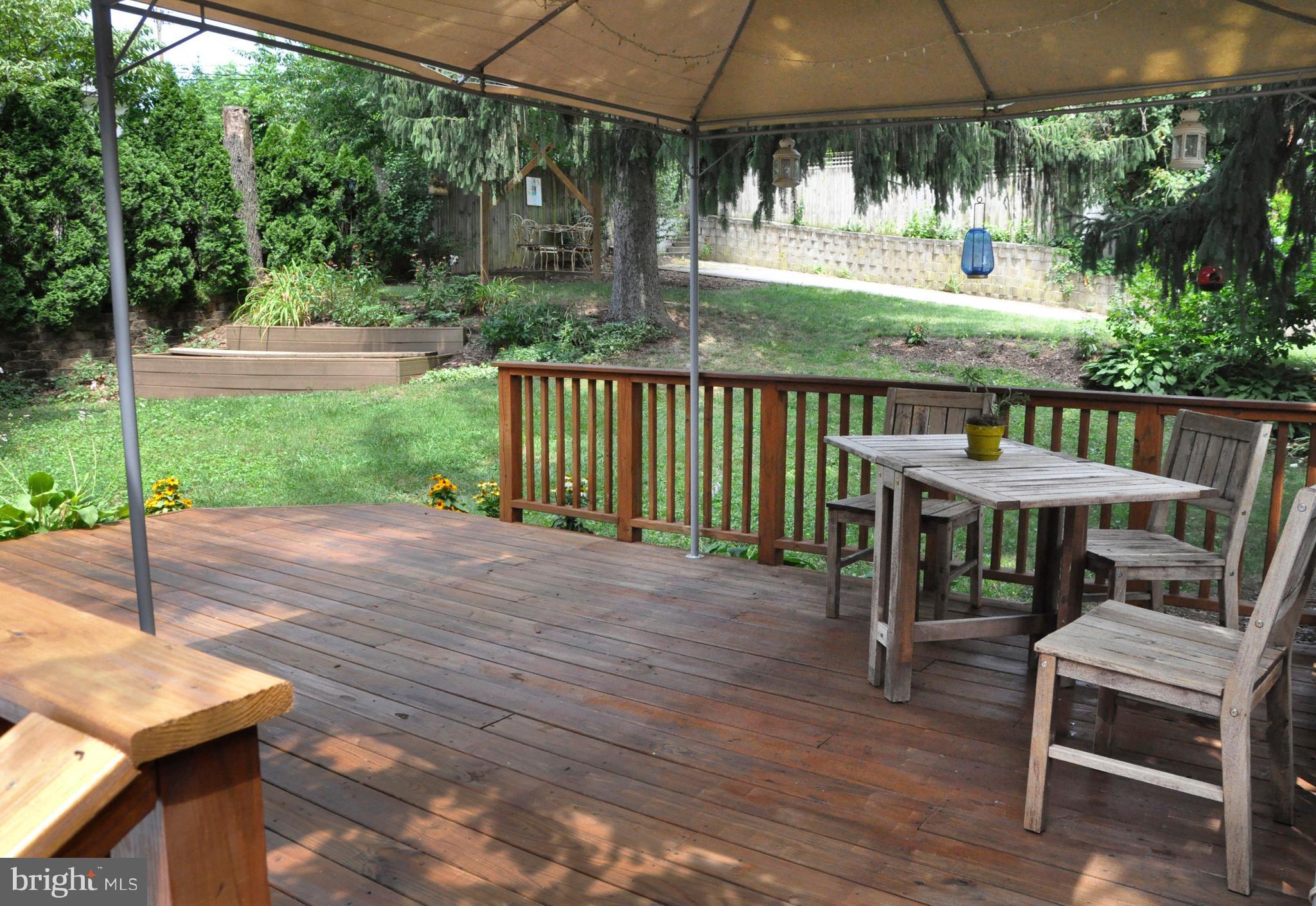 1108 Overbrook Road Baltimore, MD 21239 - Photo 19 of 20 a view of a patio with a table chairs and a backyard