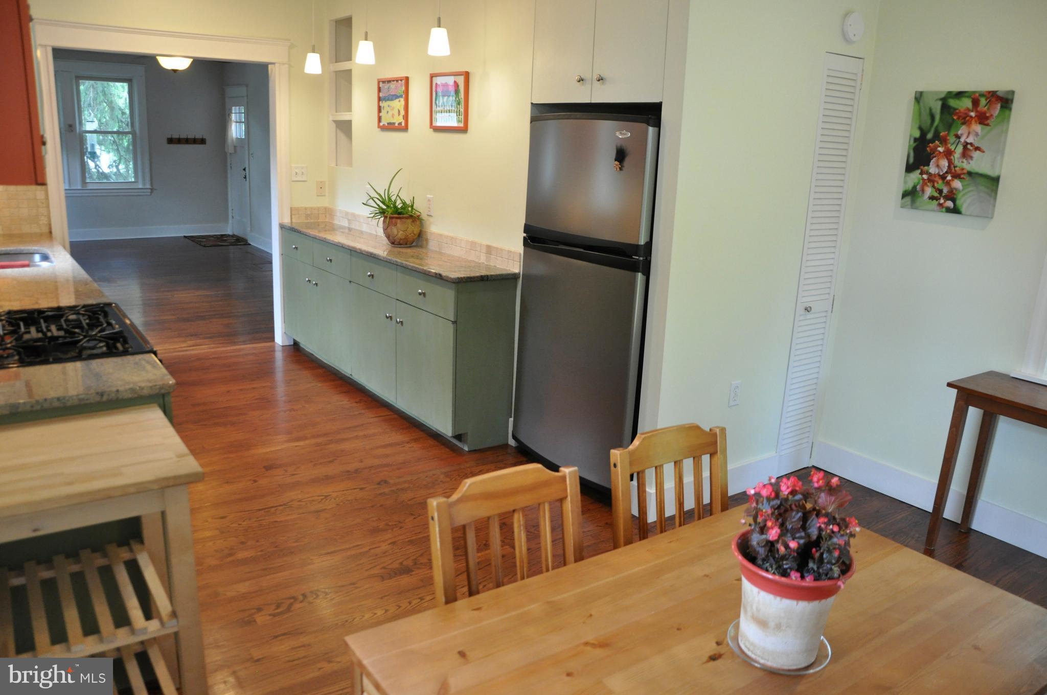 1108 Overbrook Road Baltimore, MD 21239 - Photo 5 of 20 a kitchen with stainless steel appliances kitchen island granite countertop a refrigerator and a stove