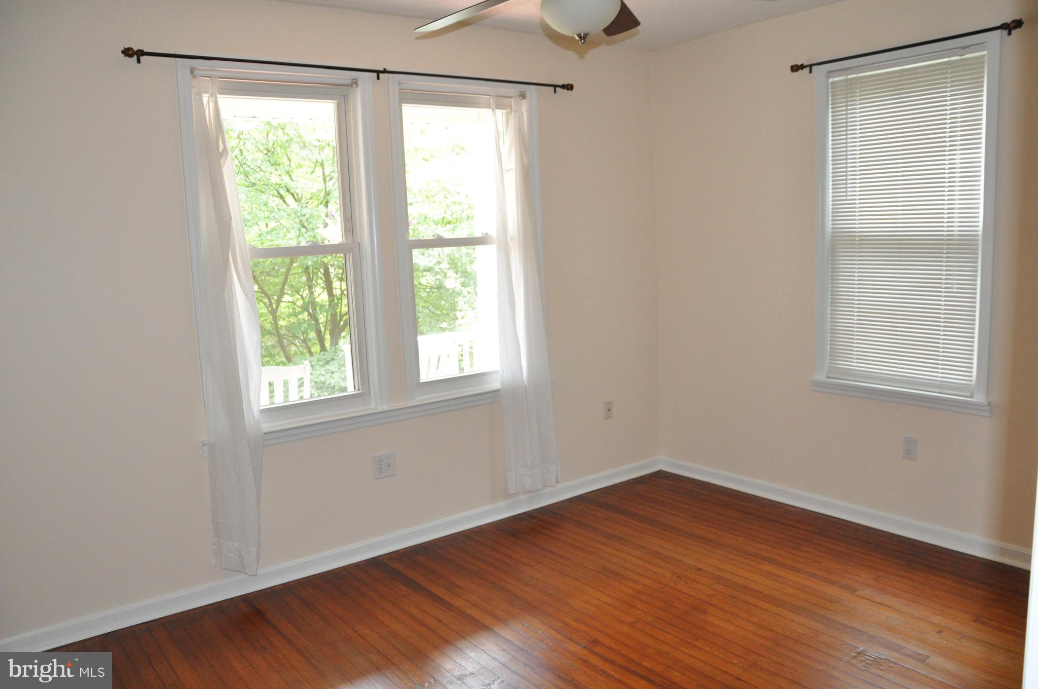 1108 Overbrook Road Baltimore, MD 21239 - Photo 8 of 20 a view of a room with wooden floor and windows