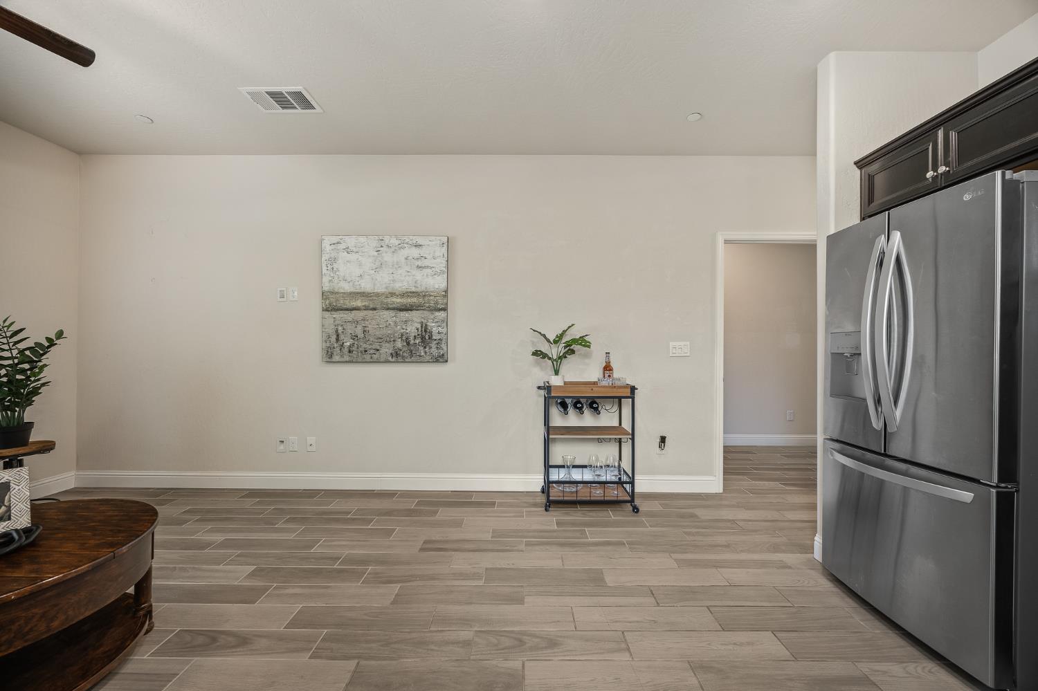 315 Timberline Way Madera, CA 93636 - Photo 11 of 75 a view of kitchen with furniture and refrigerator