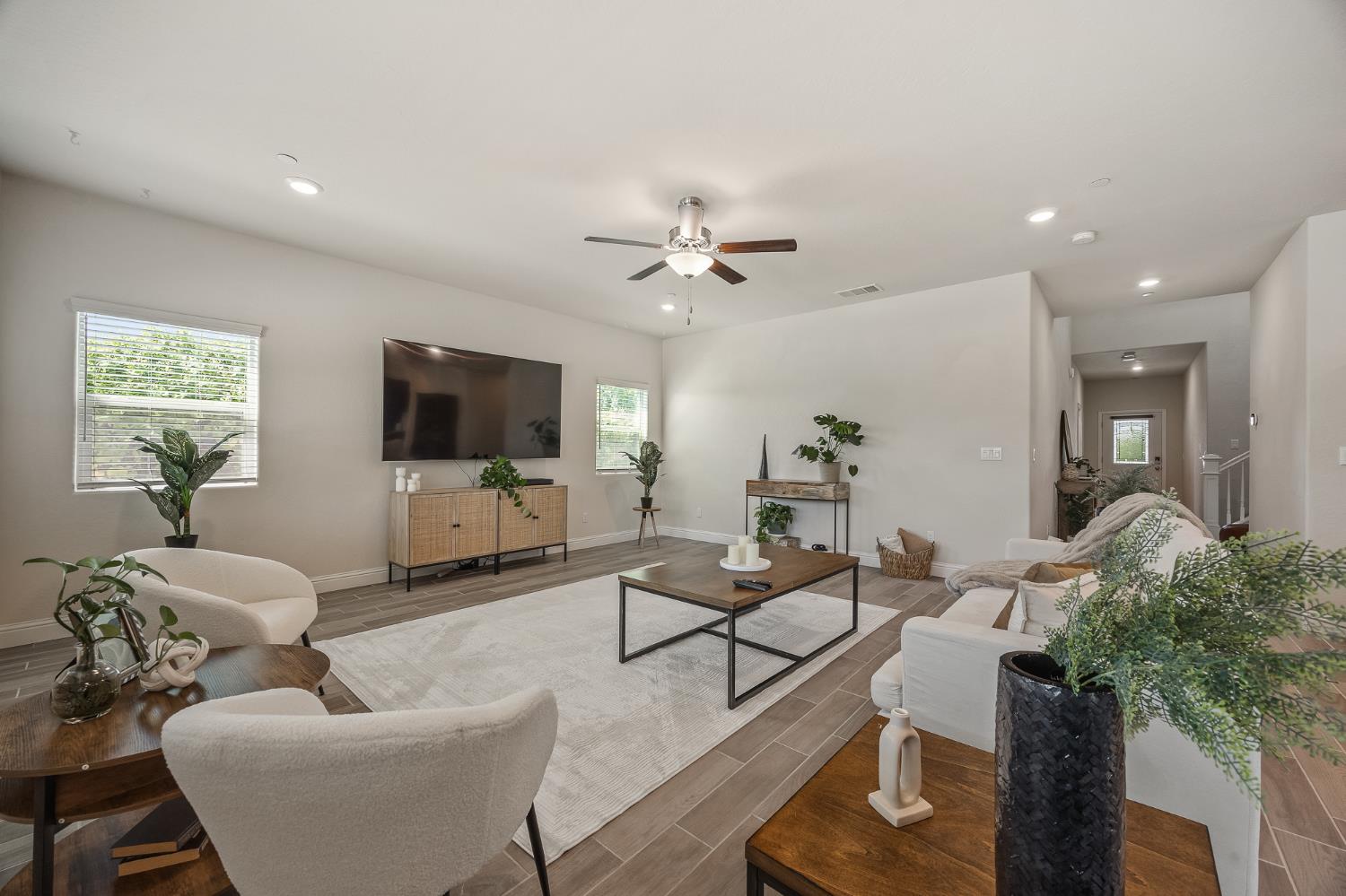 315 Timberline Way Madera, CA 93636 - Photo 21 of 75 a living room with furniture and a flat screen tv