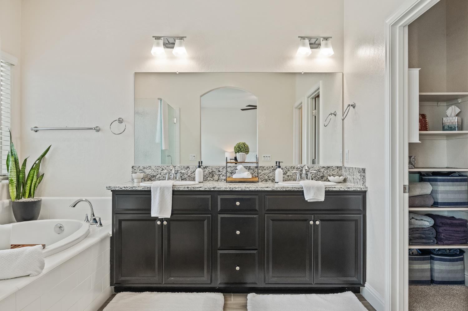 315 Timberline Way Madera, CA 93636 - Photo 51 of 75 a bathroom with a sink double vanity and a mirror
