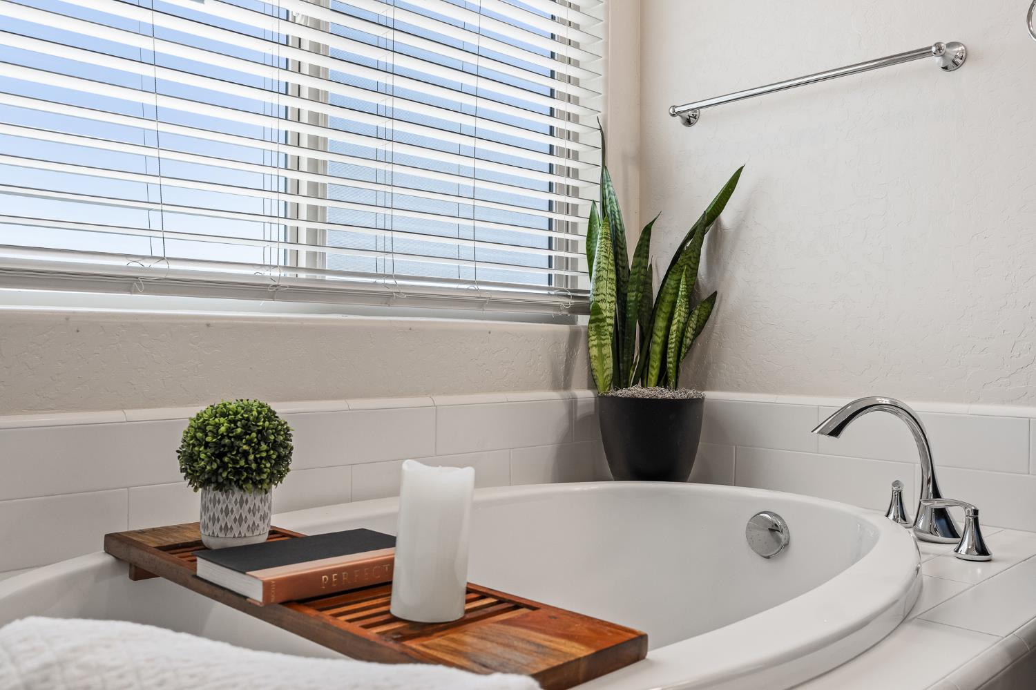 315 Timberline Way Madera, CA 93636 - Photo 55 of 75 a bathroom with a bathtub and a window