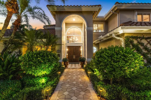 a swimming pool with trees in the background