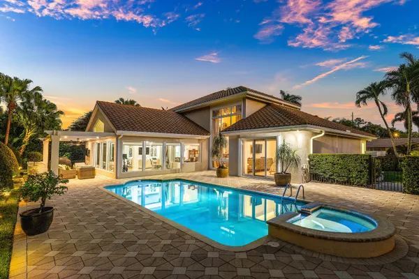 a balcony with furniture and a potted plant