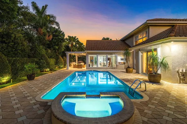 a view of living room with furniture and wooden floor