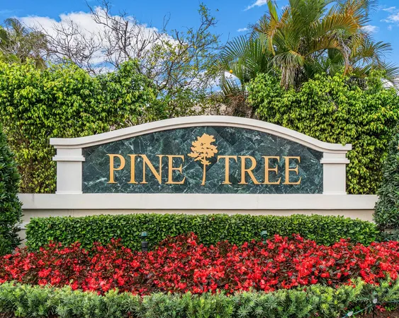 a street sign in front of flowers