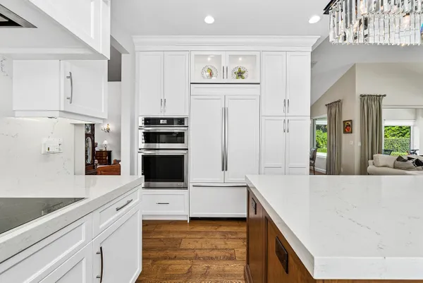 a bathroom with a double vanity sink mirror double and bathtub