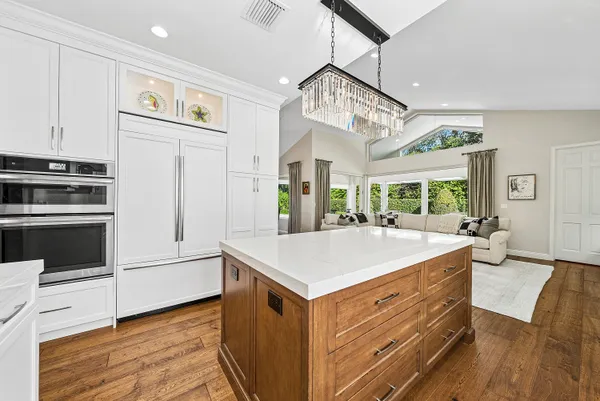 a spacious bathroom with a bathtub shower sink and mirror