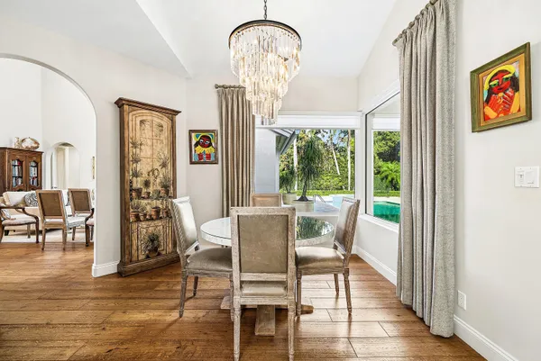 a view of living room with furniture and wooden floor