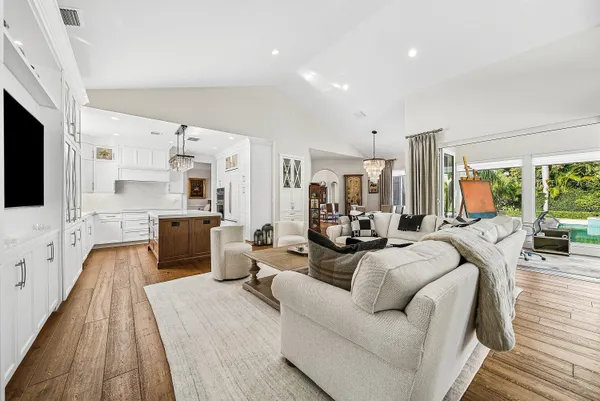 a spacious bedroom with a bed couch and a window