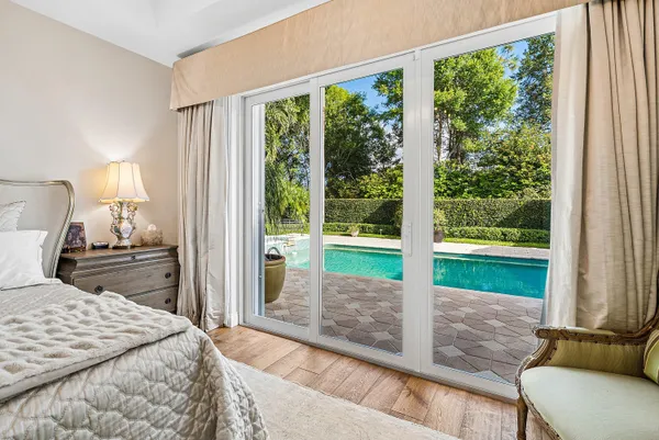 an aerial view of residential houses with outdoor space and street view