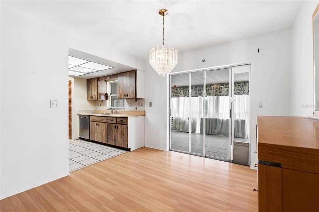 2101 Broad Ranch Drive Port Charlotte, FL 33948 - Photo 11 of 39 a kitchen with stainless steel appliances granite countertop a stove and a wooden floors