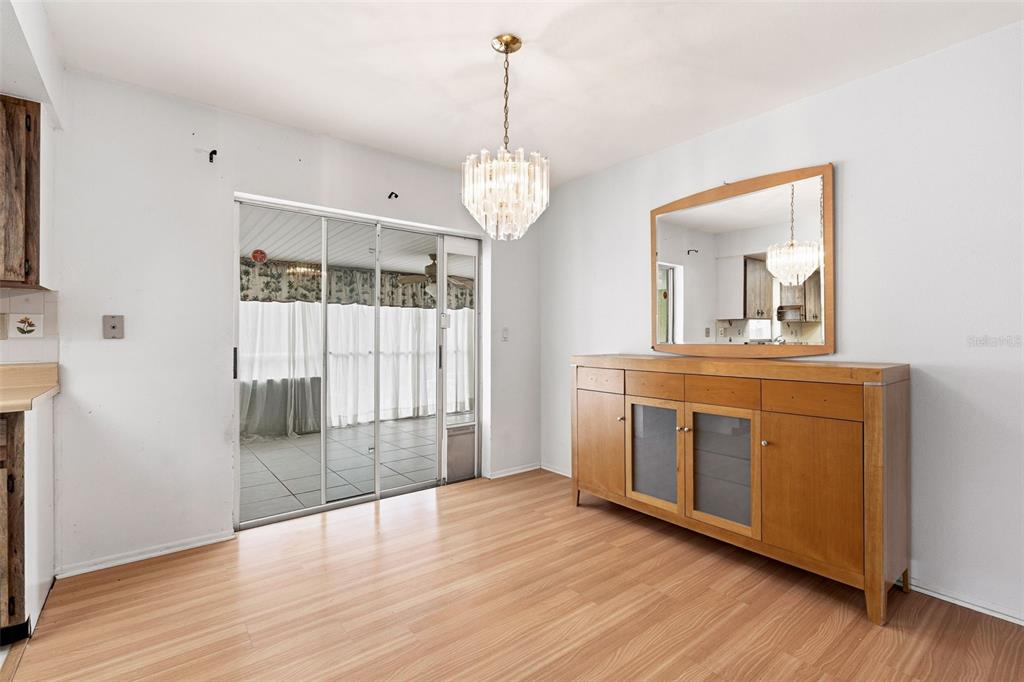 2101 Broad Ranch Drive Port Charlotte, FL 33948 - Photo 13 of 39 a view of a room with wooden floor and white walls