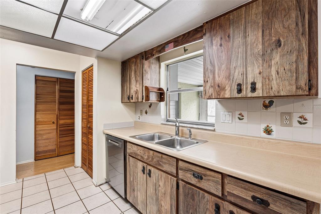 2101 Broad Ranch Drive Port Charlotte, FL 33948 - Photo 17 of 39 a kitchen with a sink and cabinets