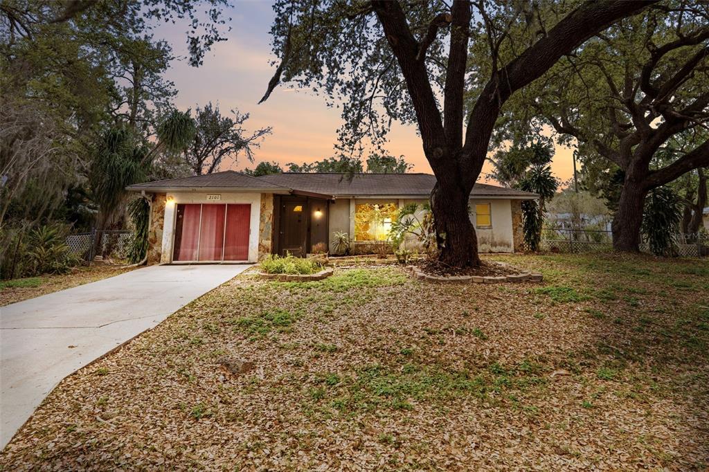 2101 Broad Ranch Drive Port Charlotte, FL 33948 - Photo 2 of 39 a front view of a house with a yard