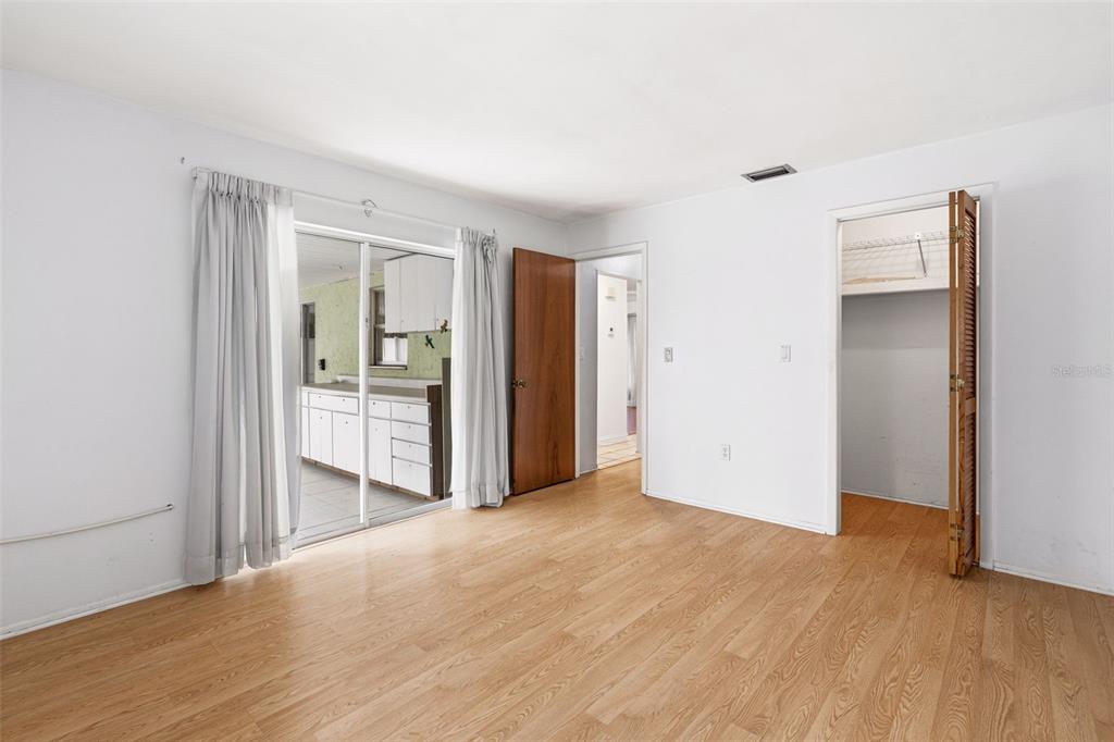 2101 Broad Ranch Drive Port Charlotte, FL 33948 - Photo 21 of 39 a view of empty room with wooden floor