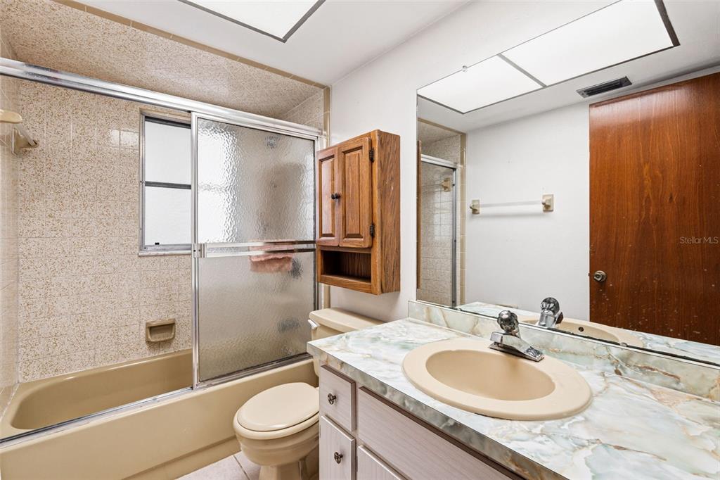 2101 Broad Ranch Drive Port Charlotte, FL 33948 - Photo 22 of 39 a bathroom with a granite countertop sink toilet and shower
