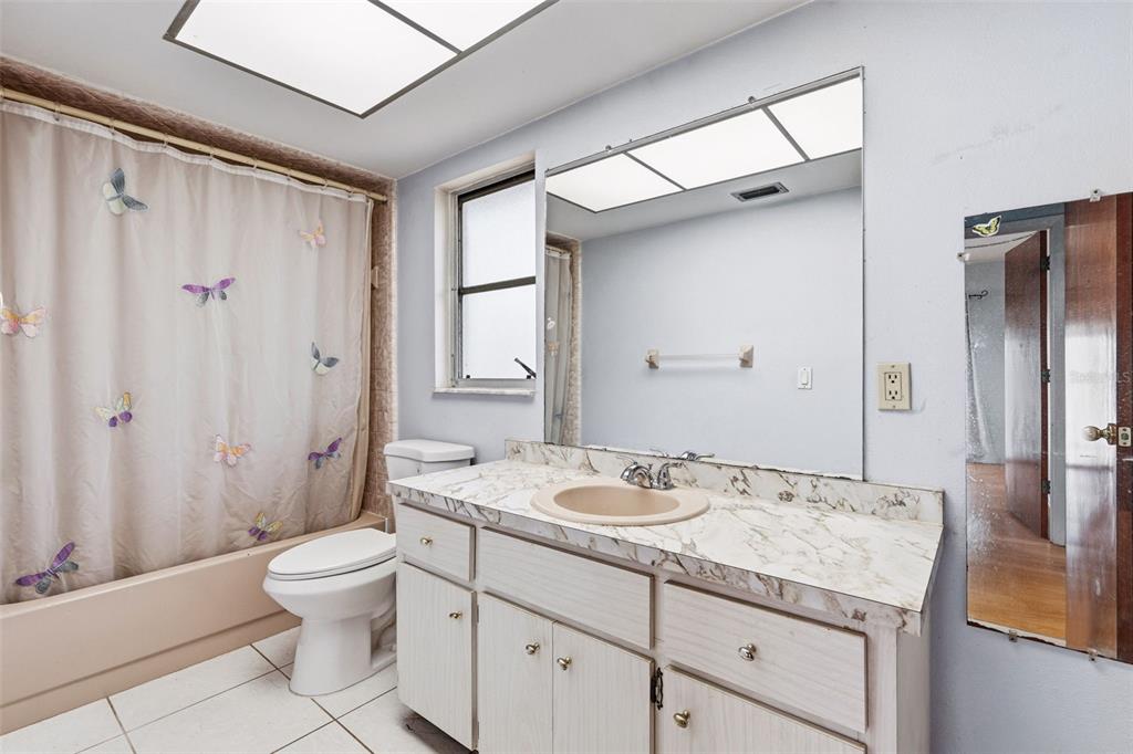 2101 Broad Ranch Drive Port Charlotte, FL 33948 - Photo 24 of 39 a bathroom with a granite countertop sink toilet and shower