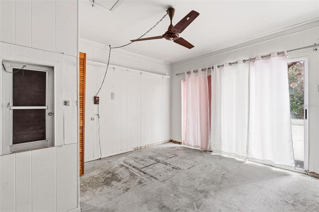 2101 Broad Ranch Drive Port Charlotte, FL 33948 - Photo 32 of 39 a view of a room with a window and a ceiling fan
