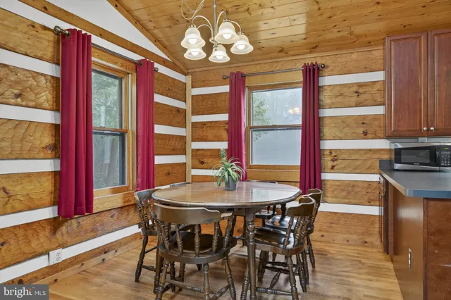 a bed room with a bed and a large window