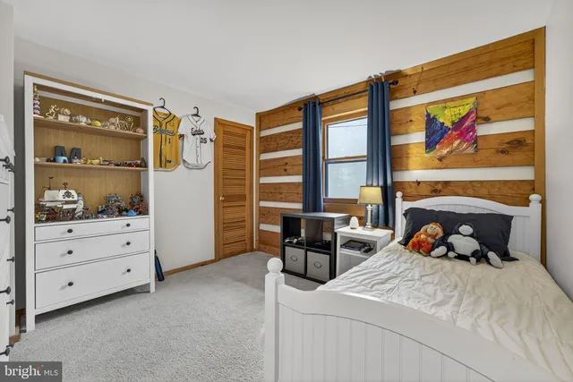 a view of an empty room with gym equipment
