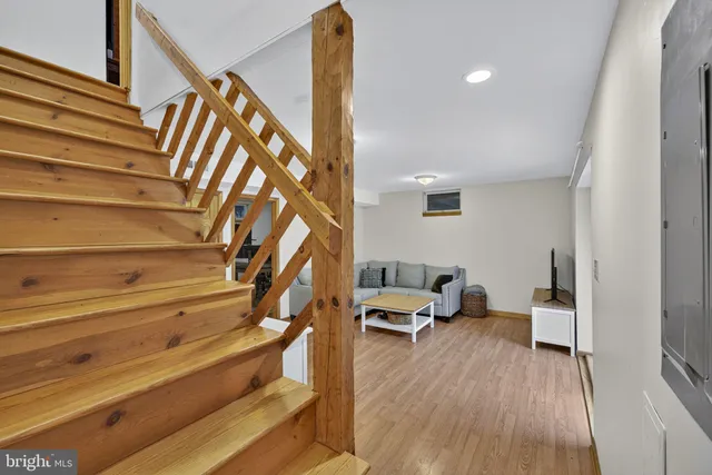 a view of a swimming pool with a sitting chair and fire pit