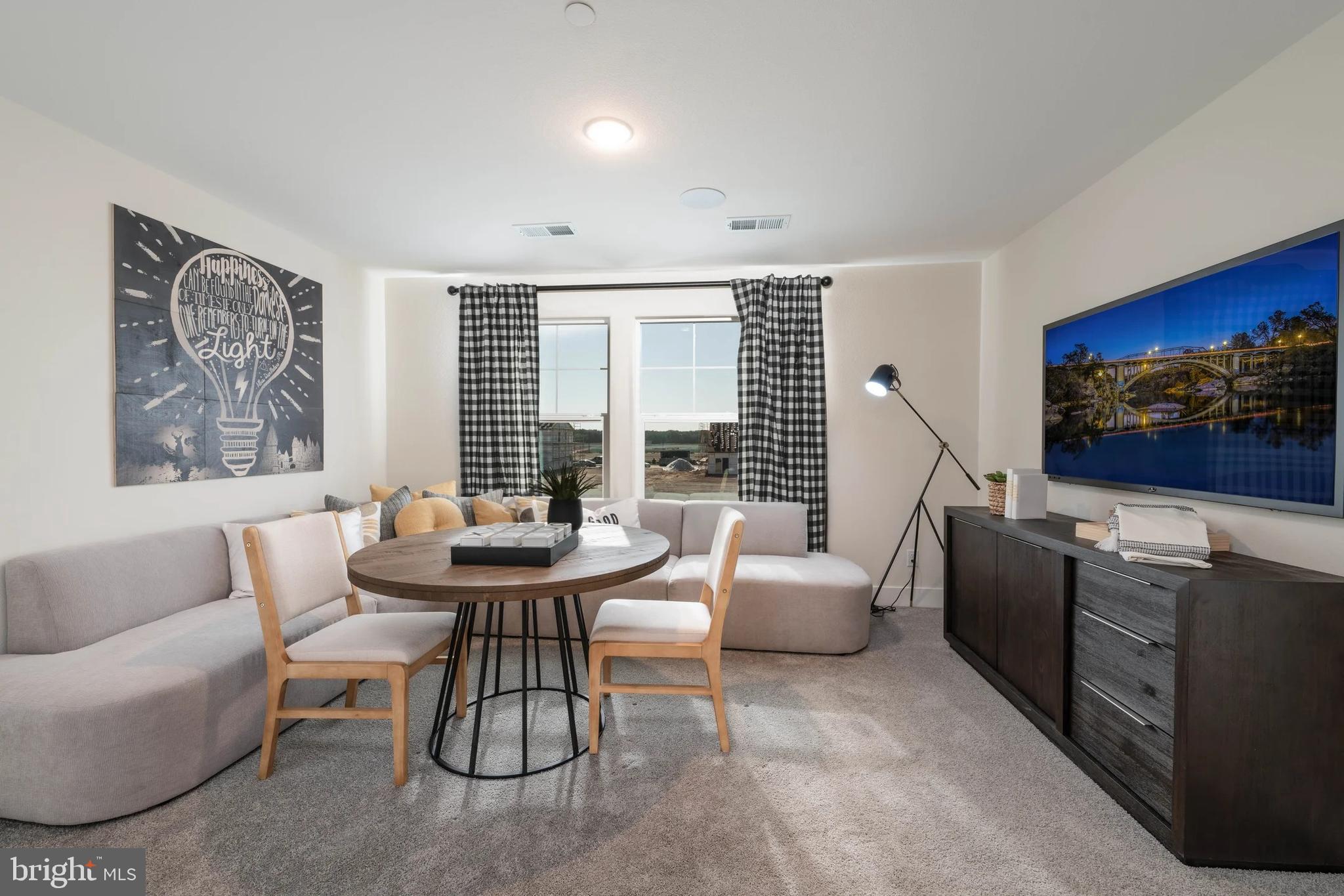 440 Gerry Street Ranson, WV 25438 - Photo 25 of 29 a living room with fireplace furniture and a flat screen tv