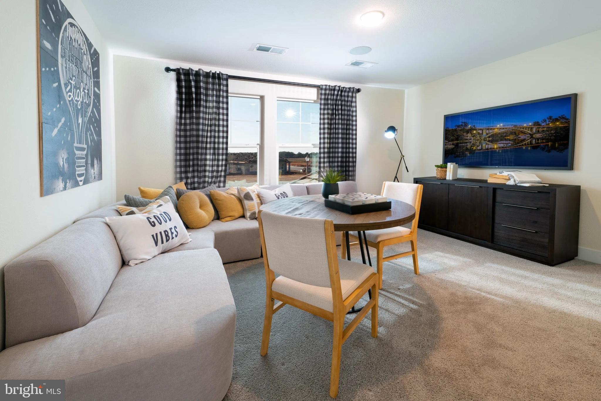 440 Gerry Street Ranson, WV 25438 - Photo 26 of 29 a living room with furniture and a flat screen tv