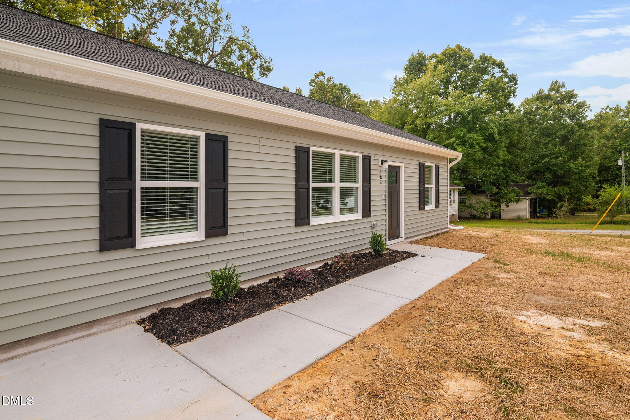 183 Magnolia Drive Roxboro, NC 27573 - Photo 12 of 31 a front view of a house with garden