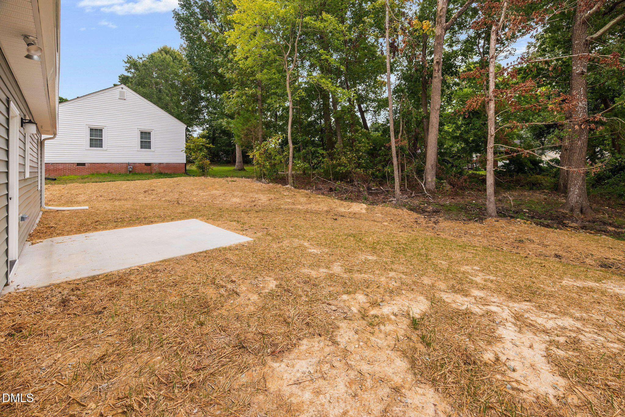 183 Magnolia Drive Roxboro, NC 27573 - Photo 13 of 31 a backyard of a house with large trees