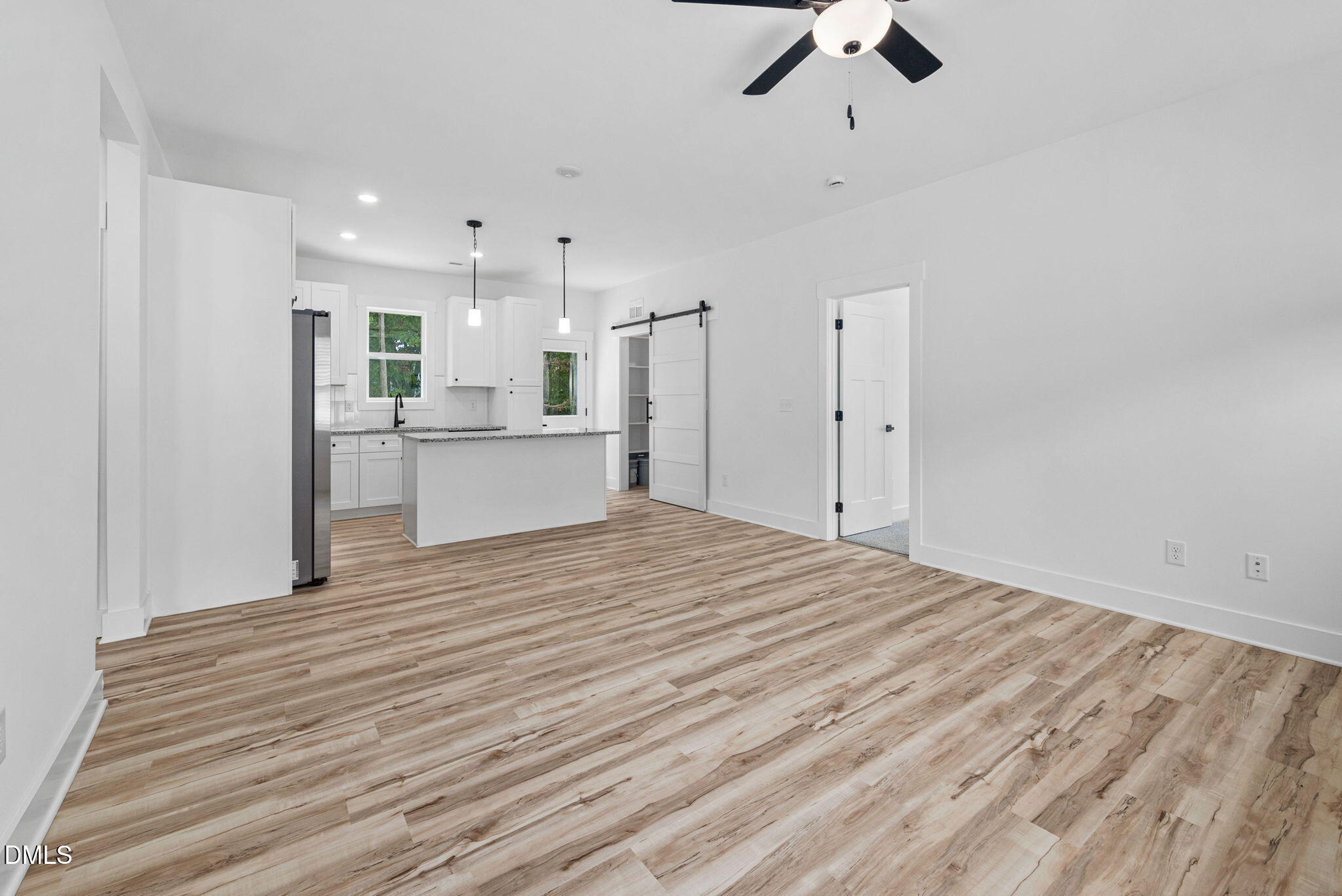 183 Magnolia Drive Roxboro, NC 27573 - Photo 17 of 31 a large kitchen with kitchen island a sink stainless steel appliances and cabinets