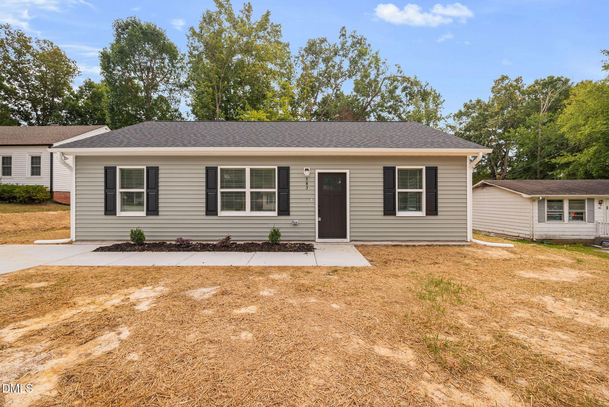 183 Magnolia Drive Roxboro, NC 27573 - Photo 2 of 31 a house that has a tree in front of it