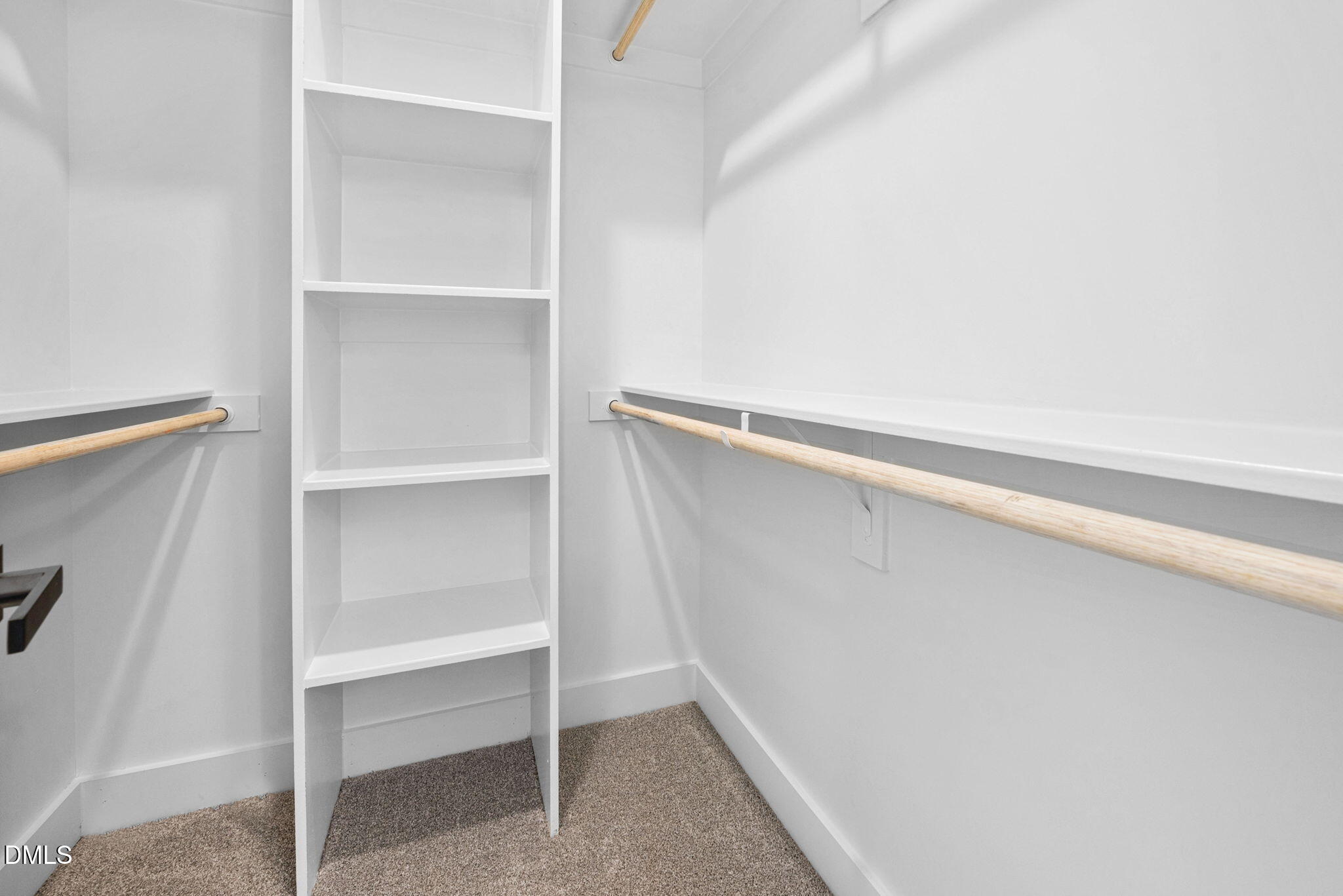183 Magnolia Drive Roxboro, NC 27573 - Photo 23 of 31 a view of walk in closet with empty racks