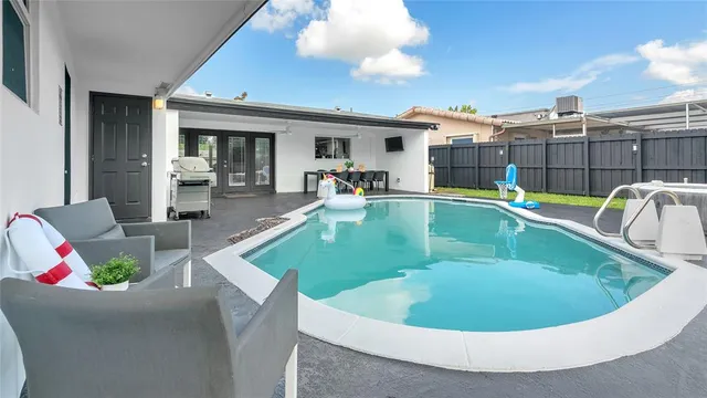a view of a house with swimming pool