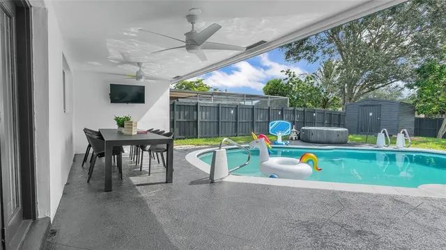 a view of a swimming pool with a lounge chairs