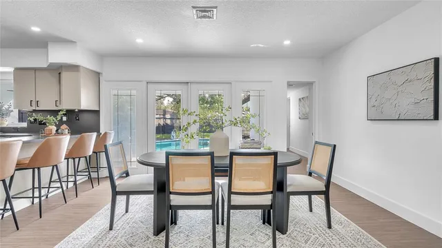 a dining room with furniture and window