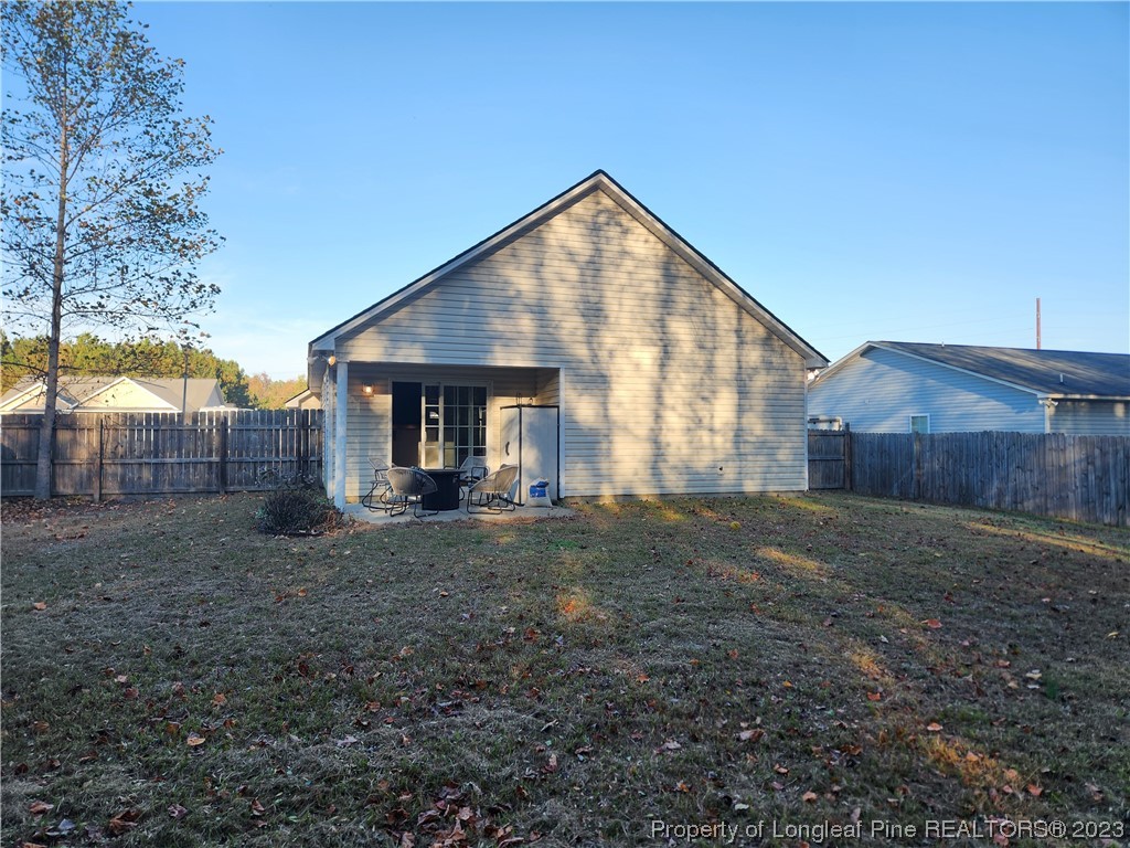 268 Cape Fear Road Raeford, NC 28376 - Photo 13 of 13 a view of a house with a backyard