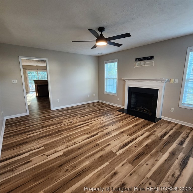 268 Cape Fear Road Raeford, NC 28376 - Photo 2 of 13 a bedroom with a bed and a fireplace