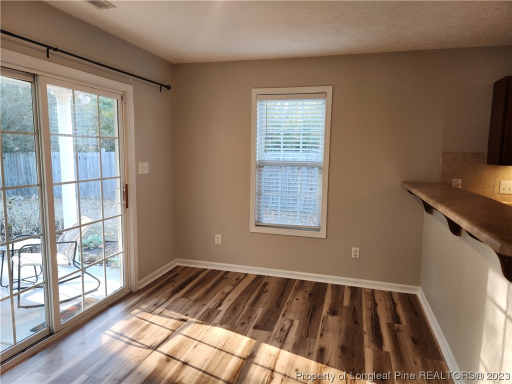 268 Cape Fear Road Raeford, NC 28376 - Photo 4 of 13 a view of a livingroom with wooden floor and a window