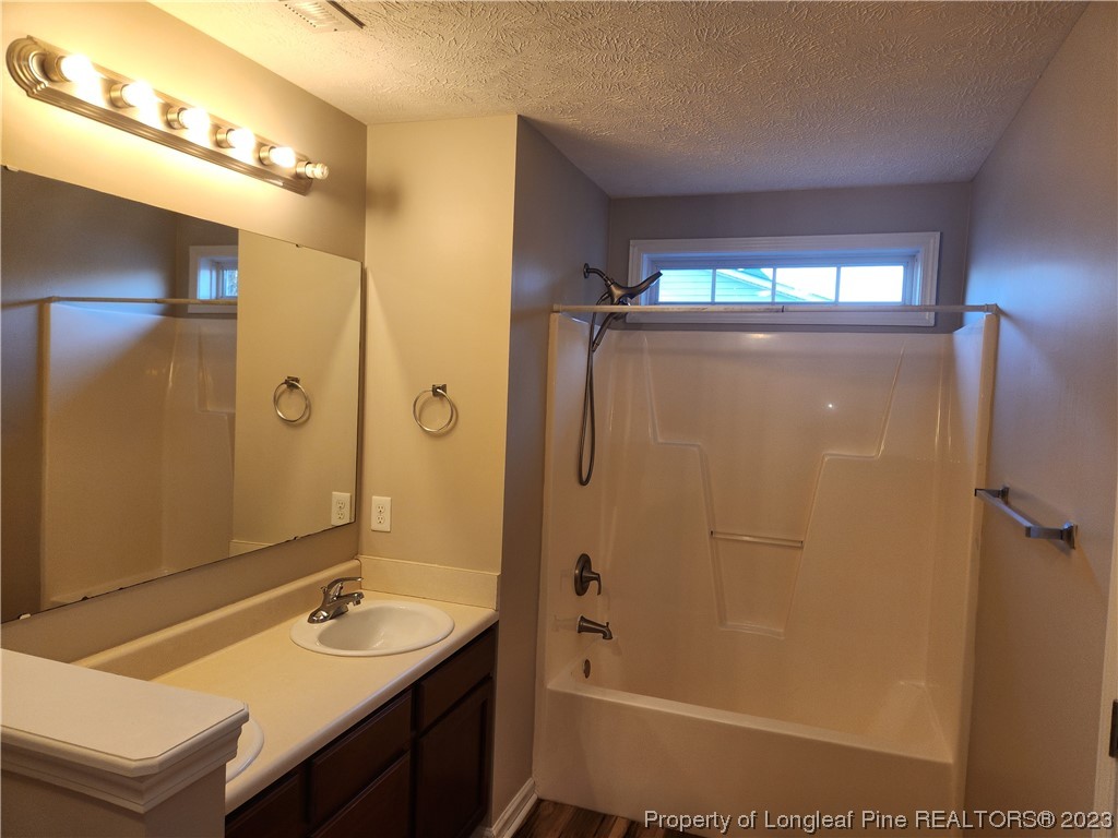 268 Cape Fear Road Raeford, NC 28376 - Photo 7 of 13 a bathroom with a sink a toilet a mirror and shower
