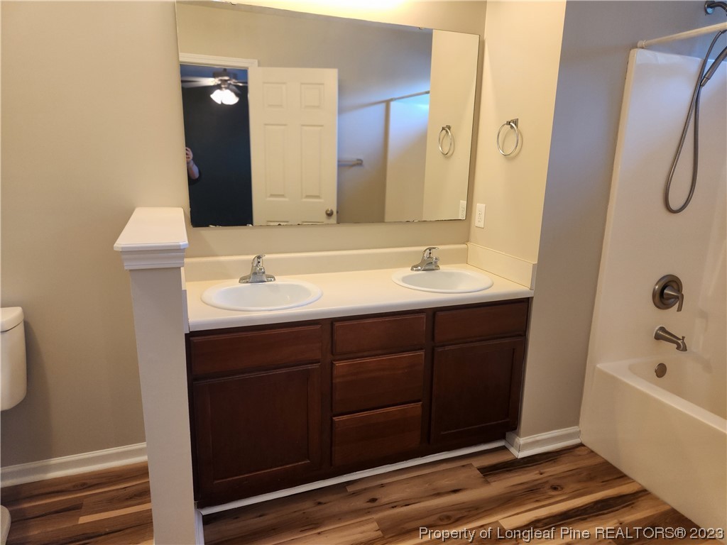 268 Cape Fear Road Raeford, NC 28376 - Photo 8 of 13 a bathroom with a tub sink and mirror