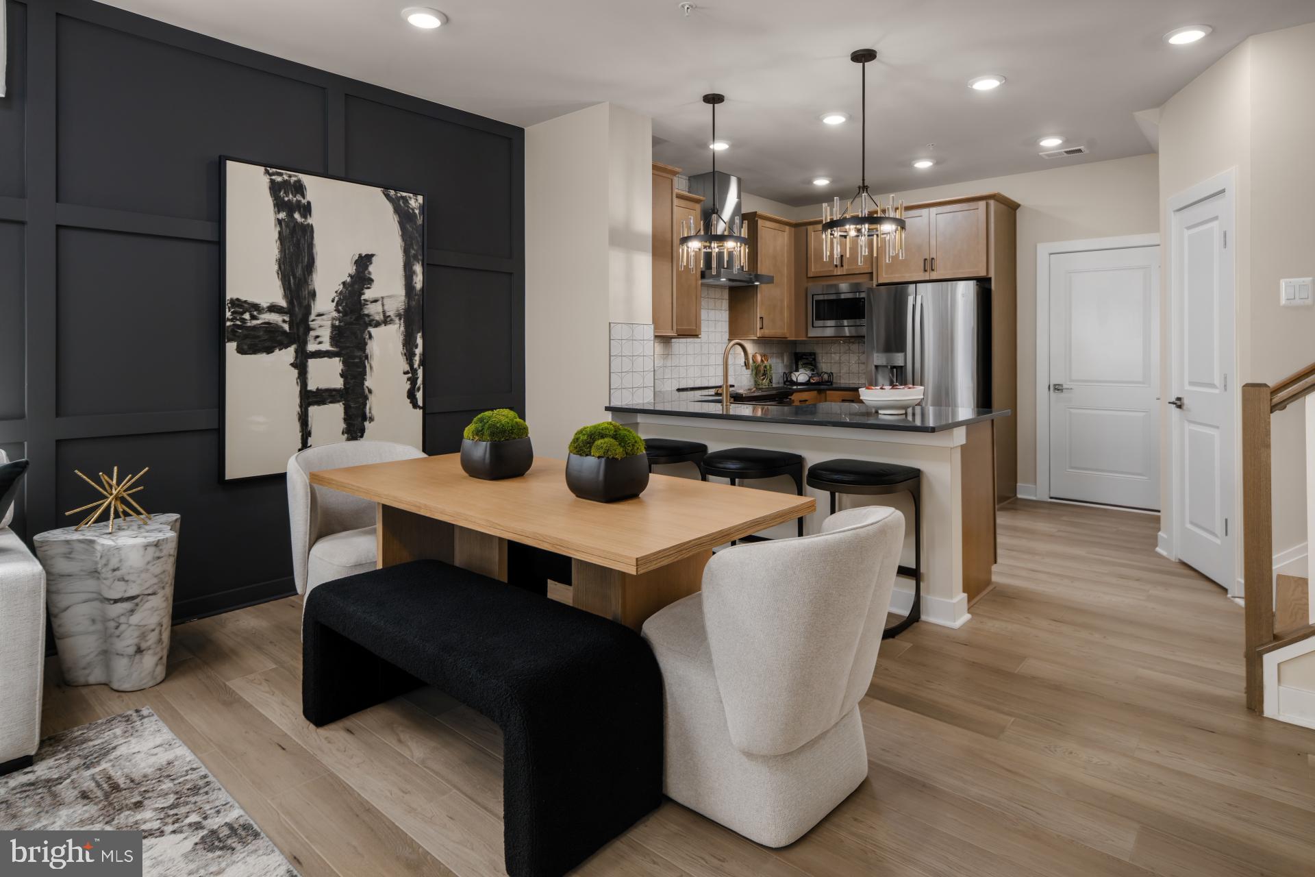 39 Strabane Terrace Ashburn, VA 20147 - Photo 4 of 15 a living room with stainless steel appliances kitchen island granite countertop furniture and a view of kitchen