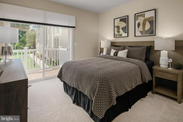 a spacious bedroom with a bed and glass door