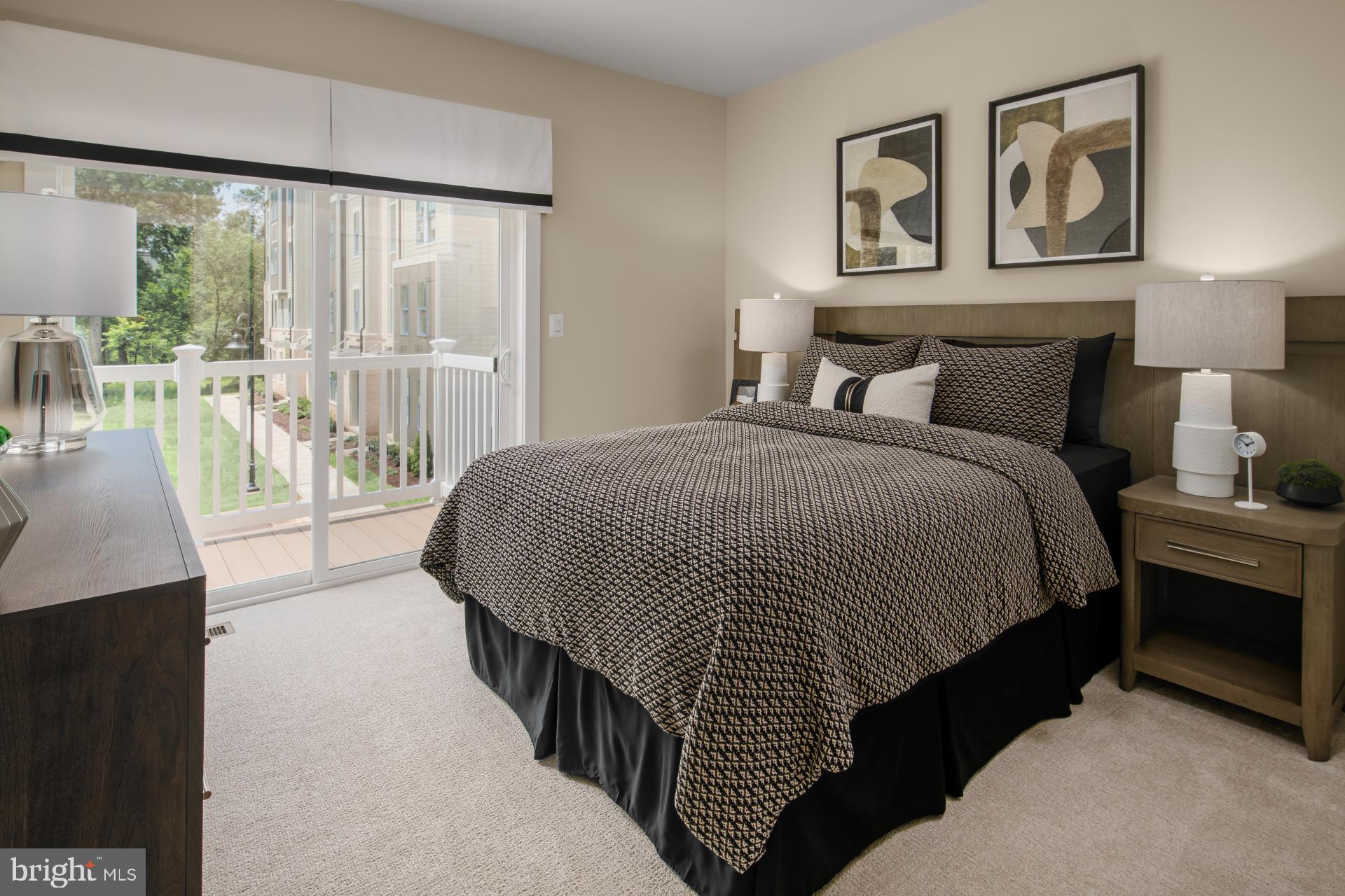 39 Strabane Terrace Ashburn, VA 20147 - Photo 9 of 15 a spacious bedroom with a bed and glass door