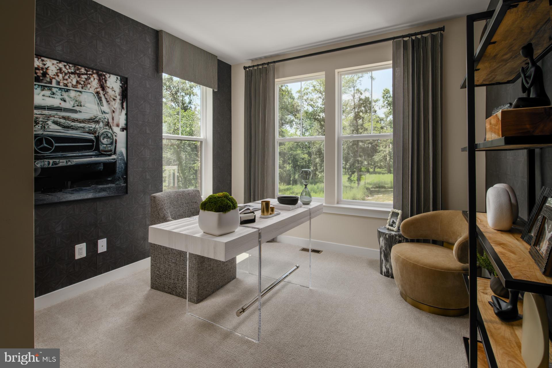 39 Strabane Terrace Ashburn, VA 20147 - Photo 10 of 15 a living room with furniture and a floor to ceiling window