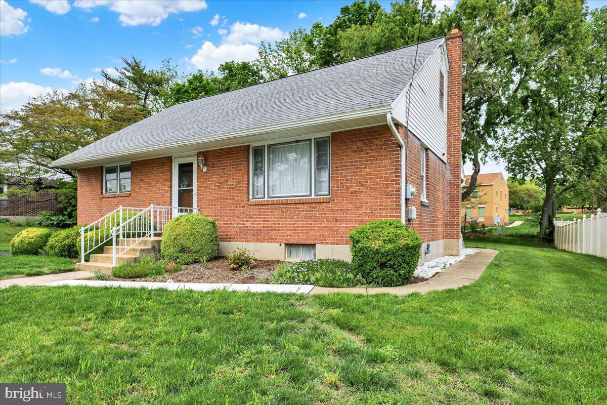 1224 Commonwealth Boulevard Reading, PA 19607 - Photo 3 of 27 a view of a house with a yard and plants